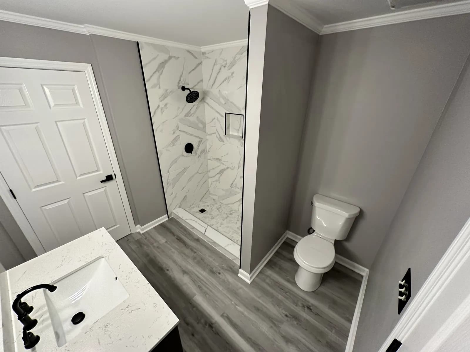 Bathroom remodel with a marble-tile walk-in shower
