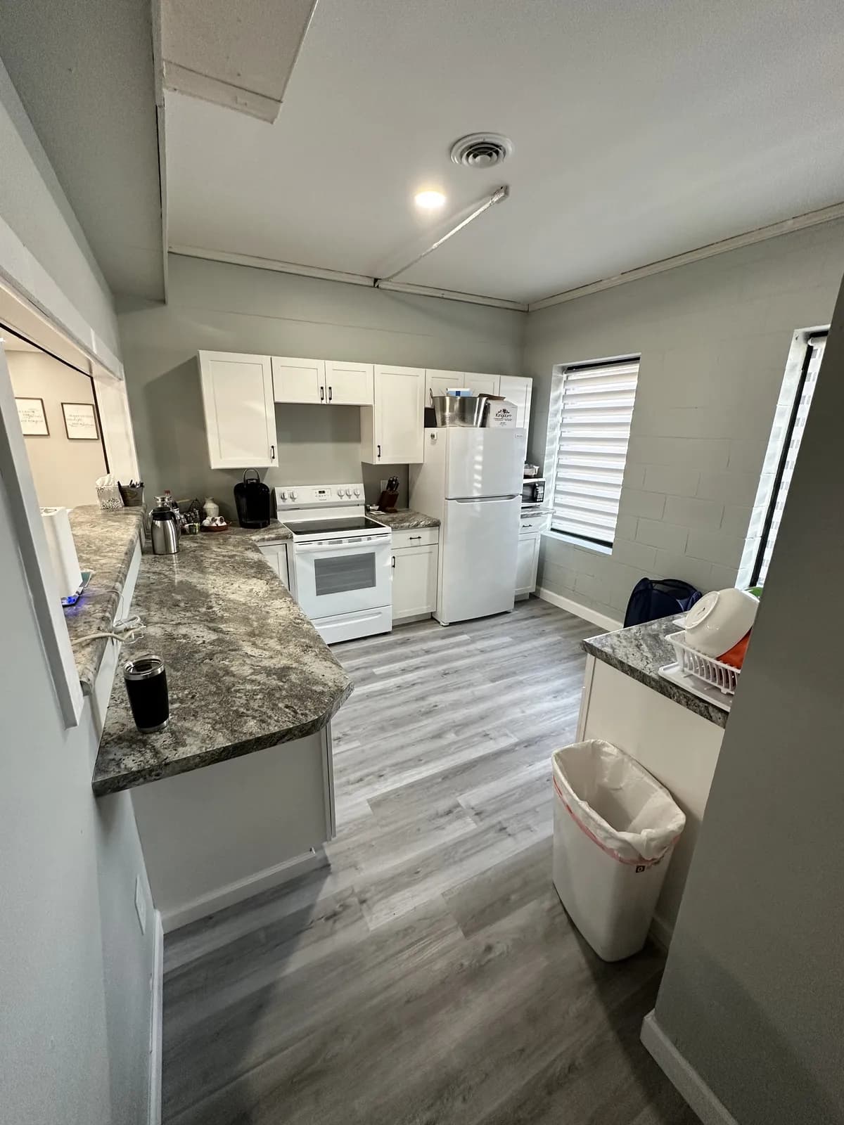 Bright white kitchen remodel completed while the homeowners stayed in place