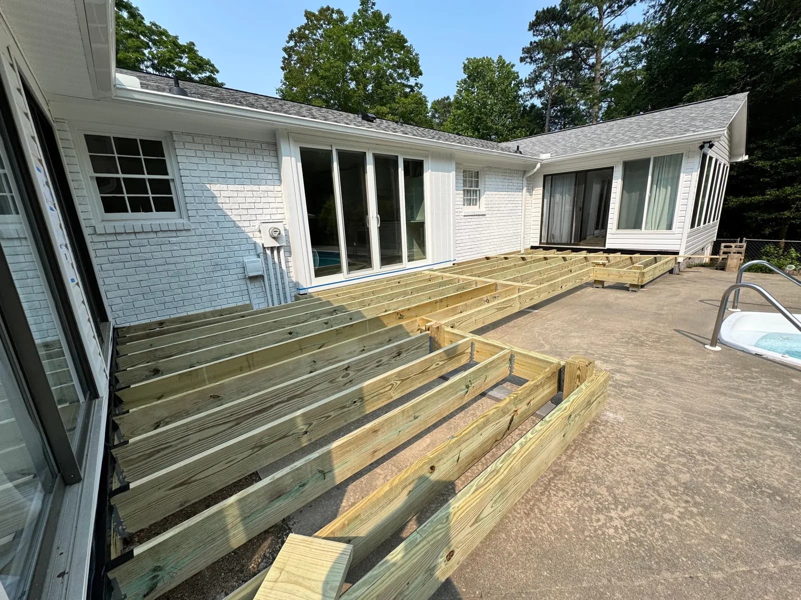 Single-story Upstate residence with a new deck and exterior stairs
